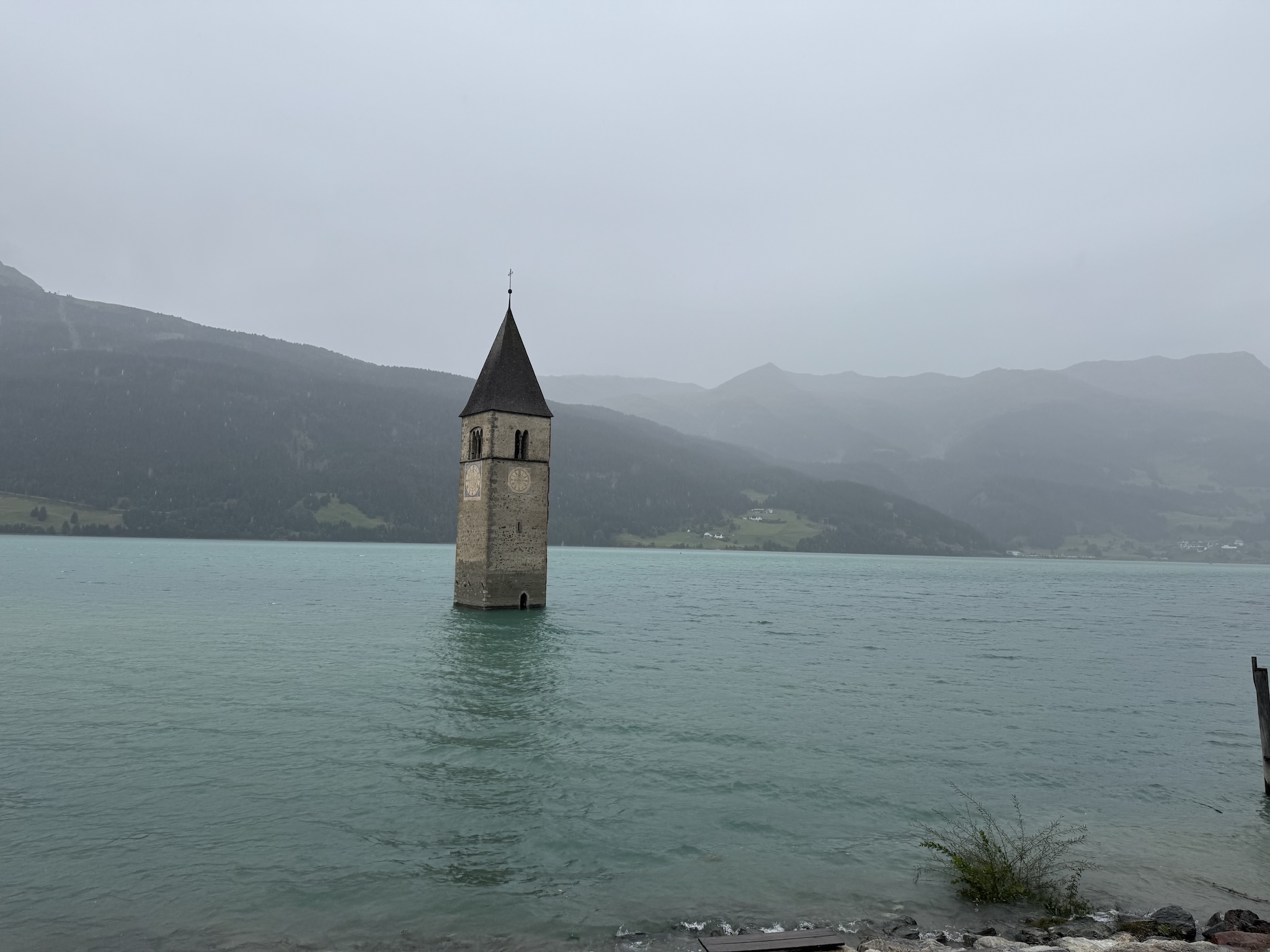 A tower in a mountain lake